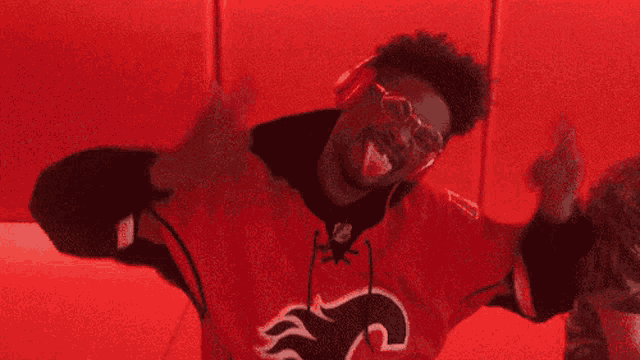 a man in a red jersey with flames on it