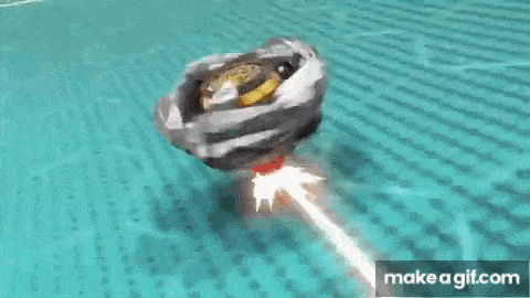 a close up of a beyblade spinning on a table .