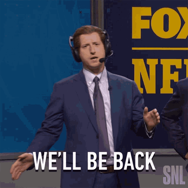 a man in a suit says we 'll be back snl