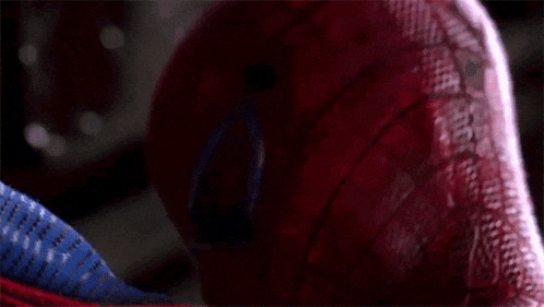 a close up of a spider man 's face with glasses
