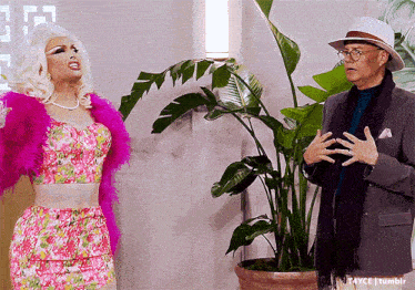 a man and a woman are standing next to a potted plant with a caption that says t4yce tumblr
