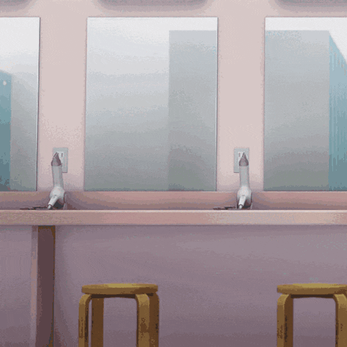 three hair dryers are sitting on a counter in front of a mirror