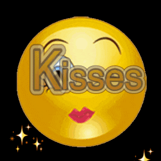 a yellow smiley face with red lips and the word kisses written on it