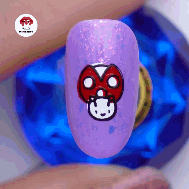 a close up of a nail with a ladybug on it and the words kylie 's inspiration below it