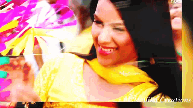 a woman in a yellow dress is smiling with the words malika creations in the corner