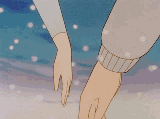 a couple holding hands in the snow with a blue background