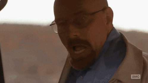 a man with glasses and a beard is making a funny face in a breaking bad scene