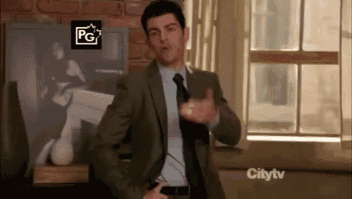 a man in a suit and tie is dancing in front of a window with a pg rating on it