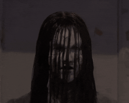 a close up of a woman 's face with a shadow on it
