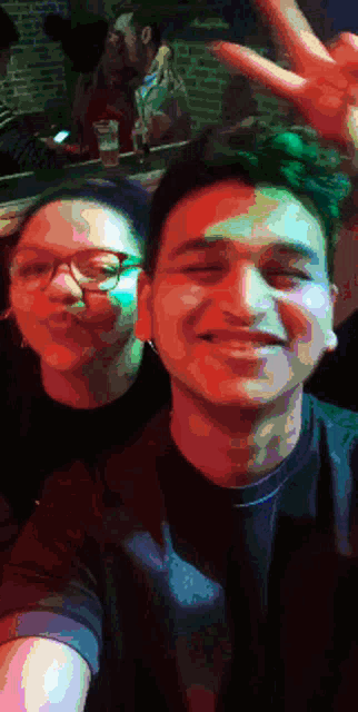 a man and a woman are posing for a picture together
