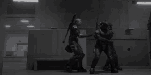 a group of soldiers are standing next to each other in a building .