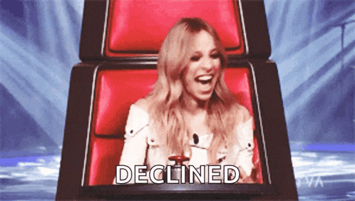 a woman sits in a red chair with the word declined written on the screen