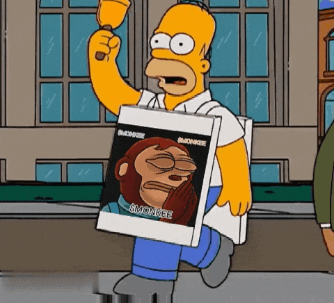 homer simpson is holding a picture of a monkey and a bell