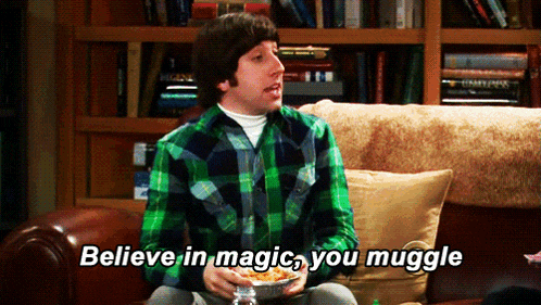 a man sitting on a couch with a bowl of food and the words believe in magic you muggle