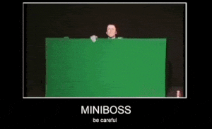 a picture of a man behind a green screen that says miniboss be careful