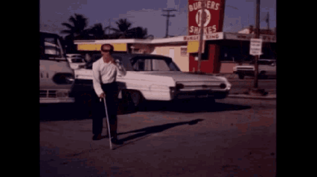 three men are walking in front of a burger king restaurant