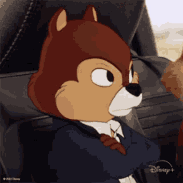 a cartoon squirrel in a suit and tie is sitting in a car seat .