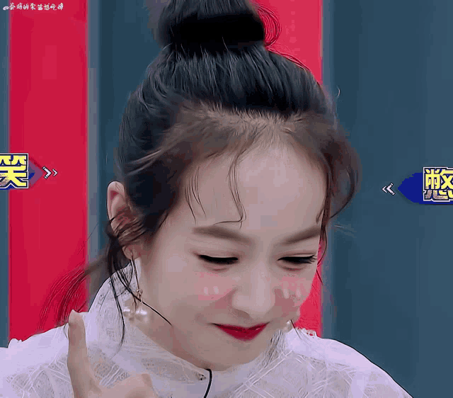 a woman with chinese writing on the bottom right corner of her face