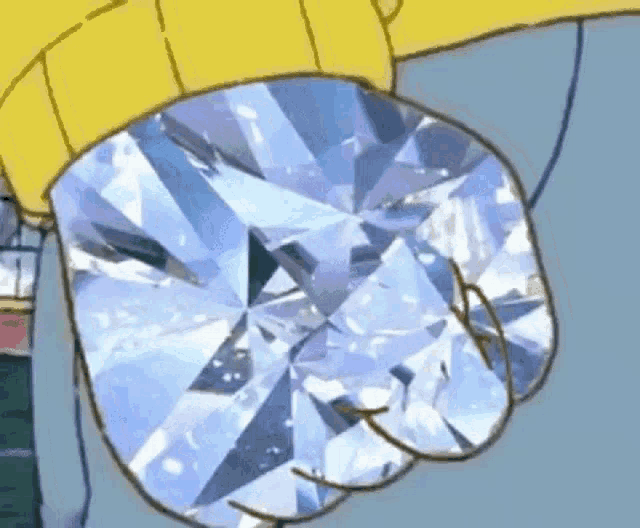 a close up of a cartoon character holding a large diamond in his fist .