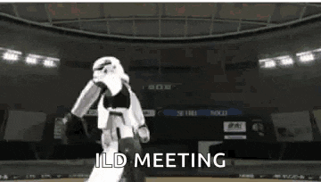a storm trooper is walking in a stadium with the words ild meeting written on the screen .