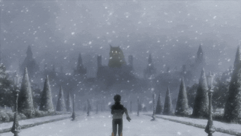 a man is standing in the snow in front of a castle .