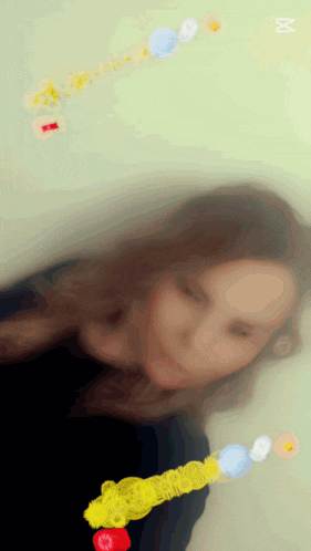 a blurry picture of a woman with the letter m visible