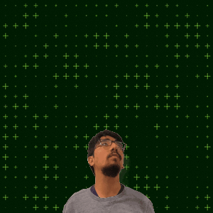a man with glasses stands in front of a green background with the numbers 8 and 5