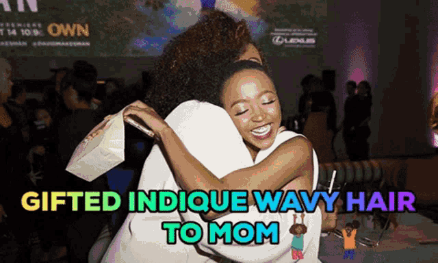 two women hugging with the words gifted indicque wavy hair to mom above them