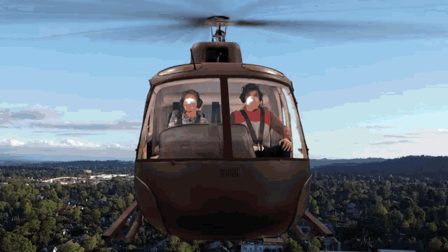 a helicopter is flying over a city and has the numbers 5830 on the side