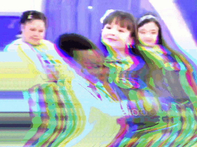 a blurry picture of three girls with the word ' tokyo ' on the bottom right corner