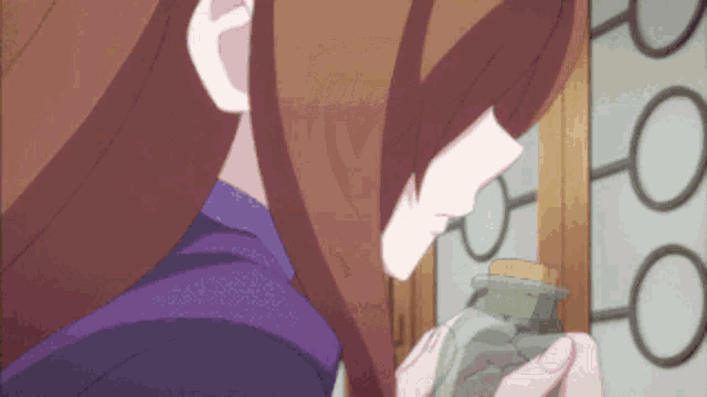 a girl with long brown hair is holding a bottle