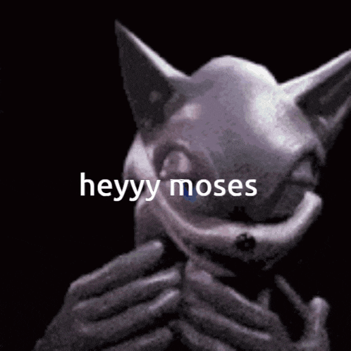 a person is holding a rabbit mask with the words heyy moses written on it .