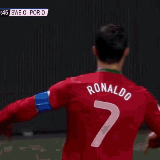 a man in a red shirt with the number 49 on the front