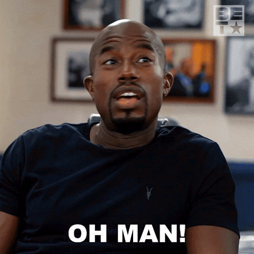 a man wearing a black shirt says " oh man "