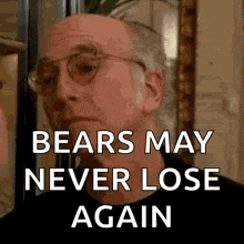 a man wearing glasses and a black shirt is talking about bears .