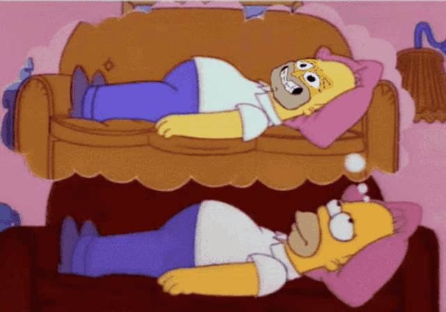 homer simpson laying on a couch with a pink pillow