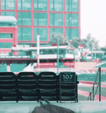 a row of black chairs with a sign that says 107