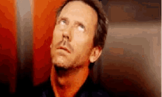 a man with a beard and mustache is looking up at the sky .
