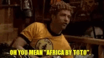 a man in a yellow shirt is saying oh you mean africa by toto .