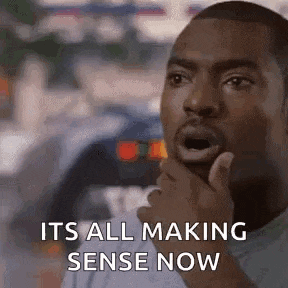 a man is making a funny face and saying `` it 's all making sense now '' while holding his chin .