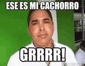 a man is making a funny face with the words ese es mi cachorro grrrr !