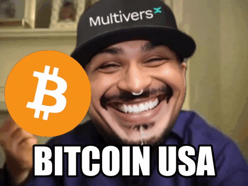 a man wearing a hat that says multivers holds a bitcoin