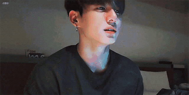 a close up of a person 's face with a sticker that says ' j-hope ' on it
