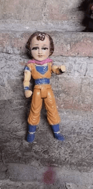 a figurine of jesus dressed up as a dragon ball z character .