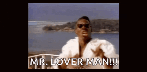 a man wearing sunglasses and a white shirt is standing on a boat and says `` mr. lover man '' .