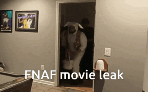 a man in a bunny costume is walking through a door with the words fnaf movie leak written on the bottom