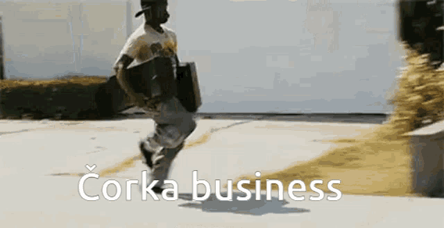 a man carrying a briefcase is running with the words corka business written in white letters