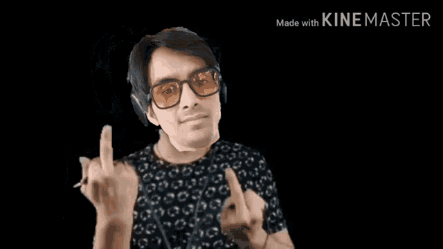 a man wearing glasses and headphones is making a middle finger sign