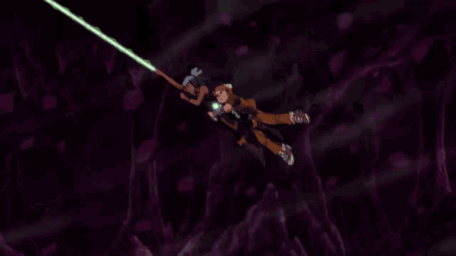 a couple of people are flying through the air with a green light behind them