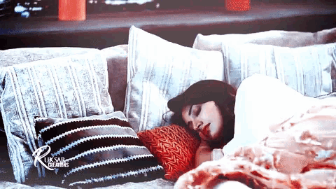 a woman sleeping on a couch with uk sad creations written on the bottom right